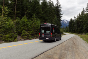Karma campervan driving through trees Vancouver 