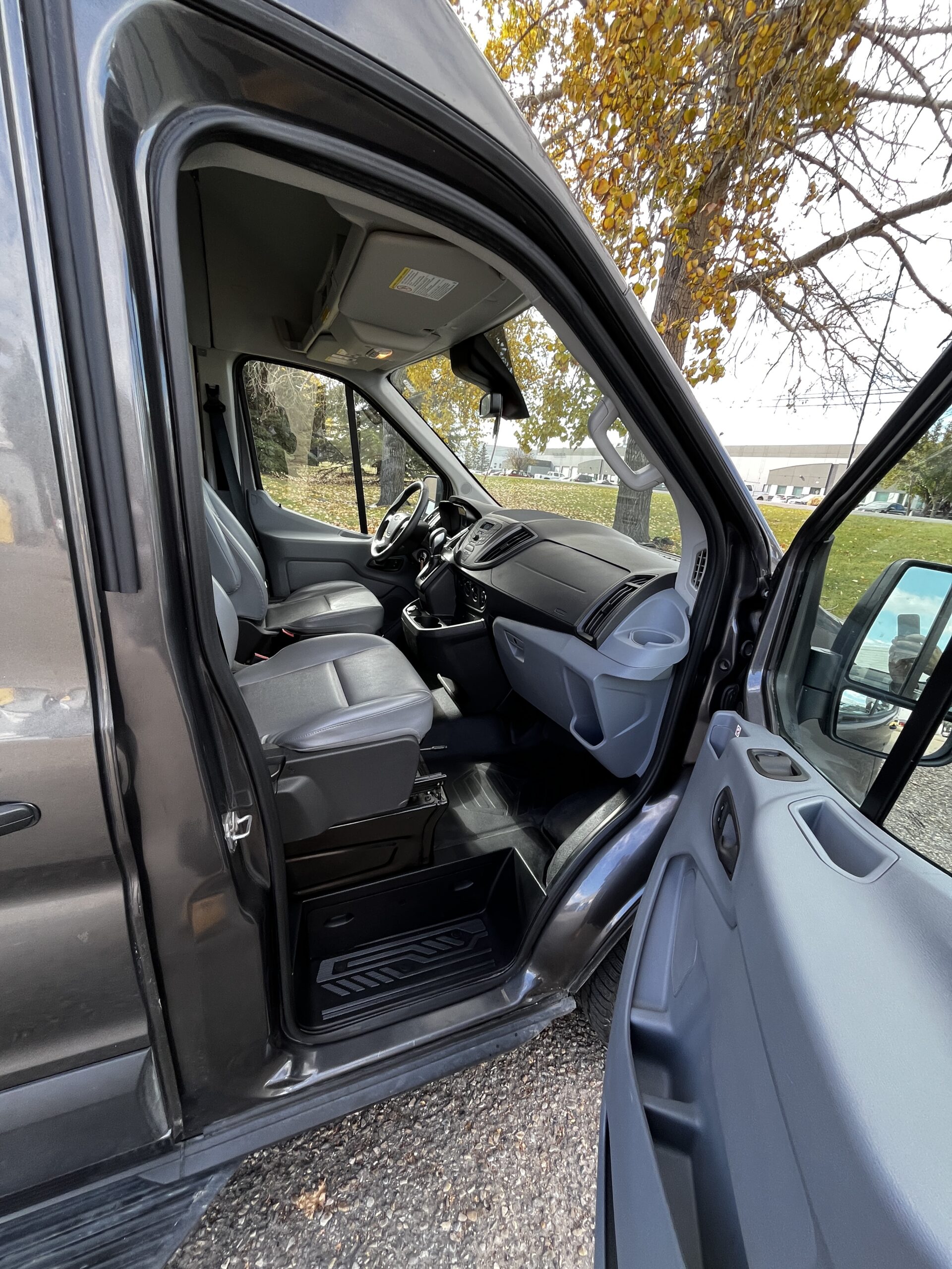 interior view of a driver and passenger seat within a camper van